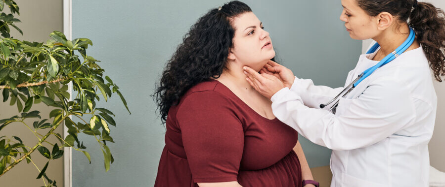 Doctor Palpation of Woman's Neck For Diagnostics Of Thyroid