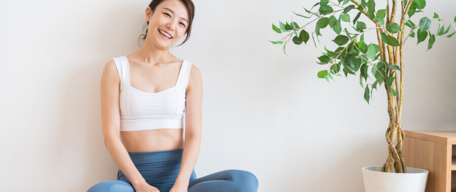 Young woman indoors feeling better after finding functional medicine