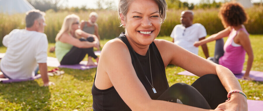 Woman at outdoor event, feeling better after treatment for Hashimoto's Disease