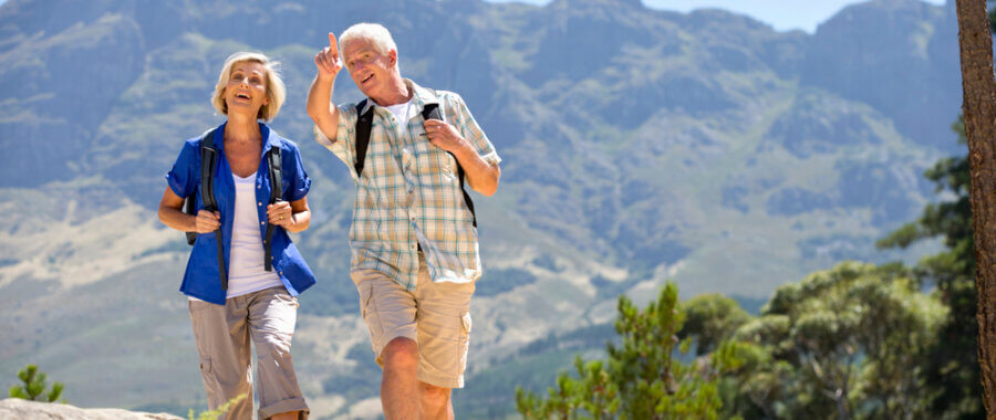 a couple is walking down a hill