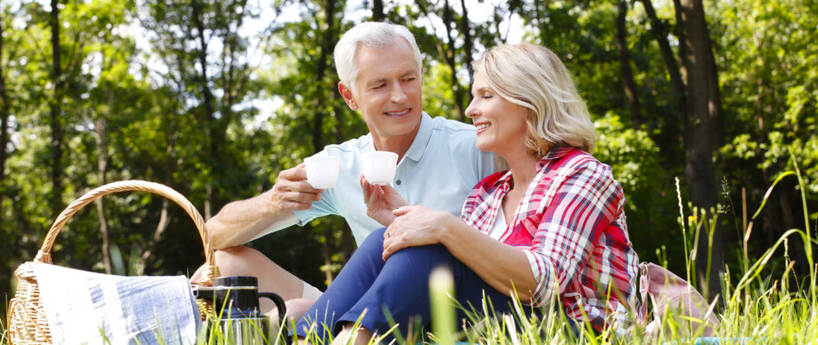 Couple with fatigue resting in park