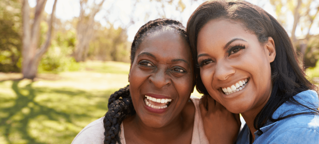 Two women smiling.