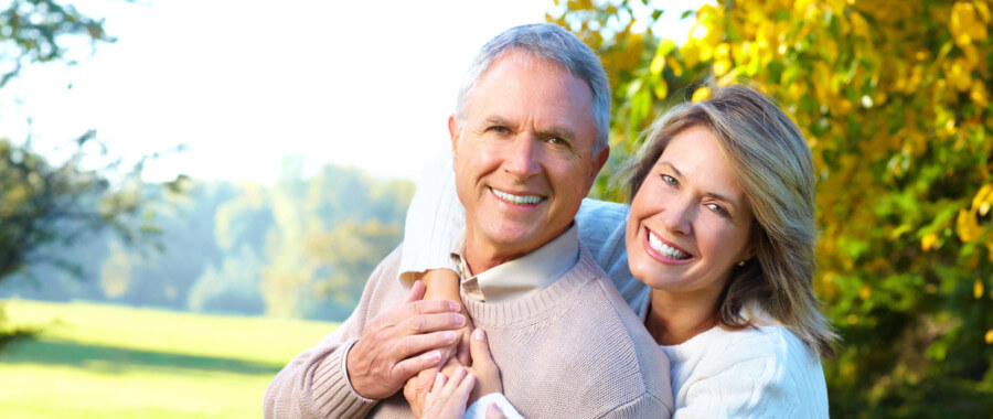 Happy older couple visit park.