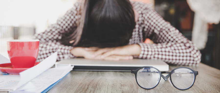 Woman experiencing exhaustion from testosterone imbalance